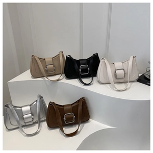 Five assorted colors of chic underarm shoulder bags with large silver metal buckles
