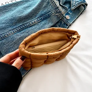 Internal view of the quilted makeup bag showing large capacity for a smartphone