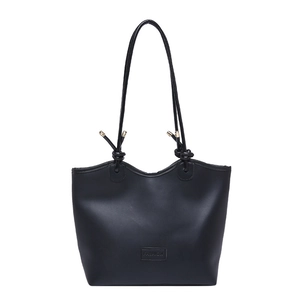 Minimalist black large capacity leather tote bag with knotted shoulder straps and gold hardware