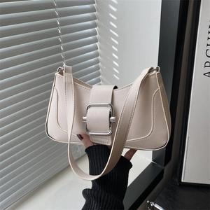 Chic beige underarm baguette bag with silver metal buckle and minimalist shoulder strap