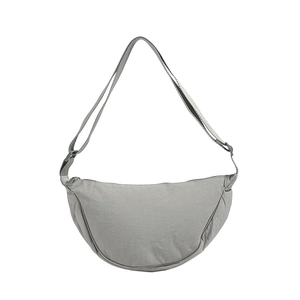 Minimalist light grey half-moon dumpling bag with adjustable shoulder strap for women