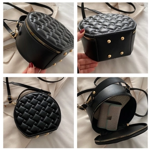 Detailed views of a black circular crossbody bag with quilted texture and gold hardware