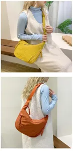 Detail of minimalist waterproof hobo crossbody bags in bright yellow and caramel colors