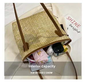 Macro view of the internal capacity of the straw tote bag showing daily essentials