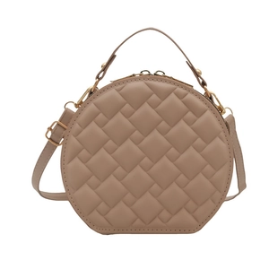 Chic milky brown circular leather handbag with elegant geometric quilted patterns