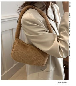 Close-up of a brown plush shoulder bag showing soft faux fur texture and stylish design