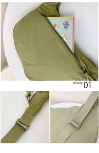 Detail view of large capacity green nylon crossbody bag with zipper and adjustable strap