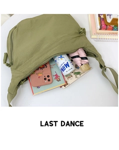 Interior storage capacity of the avocado green nylon crossbody bag with daily essentials