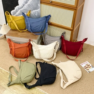 Minimalist large nylon crescent crossbody bag in multiple colors with adjustable strap