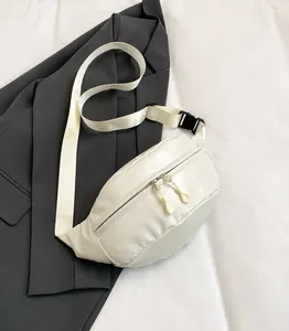 Detail of off-white PU leather sports fanny pack with double zippers and nylon strap