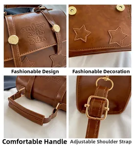 Detail view of brown leather handbag featuring embossed lettering and adjustable gold buckles