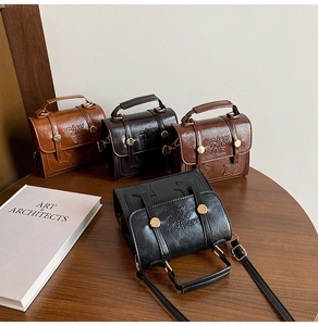 Group shot of four vintage crossbody bags in retro colors on a rustic wooden table