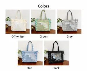 Detail showing various colors of canvas tote bags with transparent PVC pockets and ribbons
