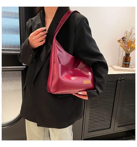 Detail of burgundy PU leather hobo bag showing large capacity and smooth texture