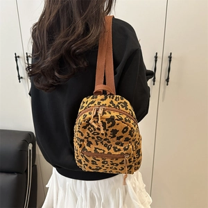 Mini leopard print corduroy backpack for women featuring adjustable brown straps