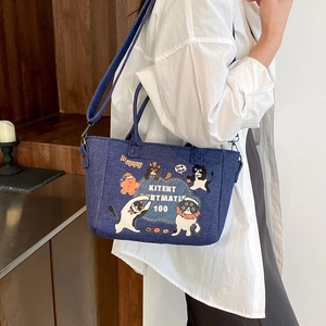 Blue denim cartoon tote bag with cat prints and shoulder strap for casual daily use