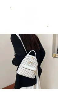 Detail view of mini monogram backpack with golden bow hardware and textile straps