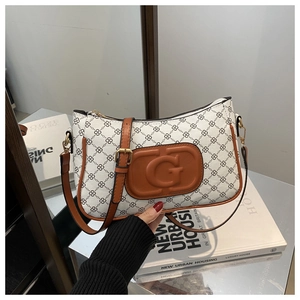 Detail of vintage square crossbody bag with chain print and brown leather G patch