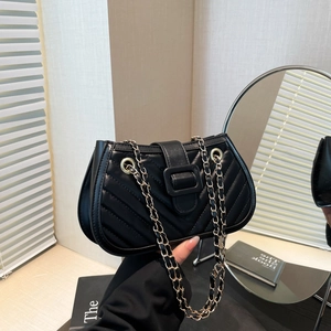 Chic black V-quilted crossbody bag with chain strap and elegant hardware in a soft interior