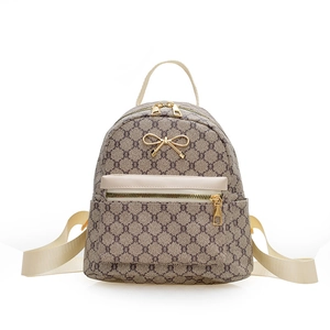 Vintage retro brown patterned mini backpack for women with gold bow accent and twin zippers