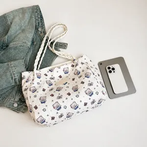 Close-up of seersucker tote bag with bear prints and white braided handles