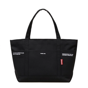 Minimalist large capacity black canvas tote bag with multi-pockets and industrial style print