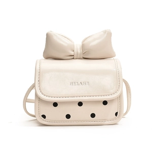 Mini cream crossbody bag for girls with large bow and black polka dot pattern