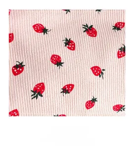 Close-up of pink corduroy fabric with strawberry pattern for high-capacity tote bags