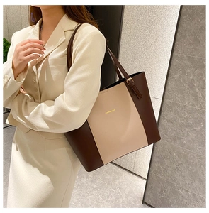 Side view of a two-tone minimalist tote bag in coffee and beige matte PU leather