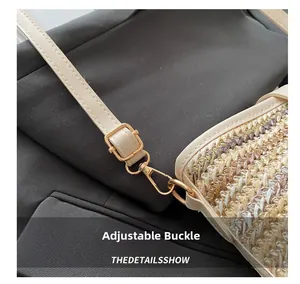 Close-up of golden adjustable buckle and woven texture on a beige PU crossbody bag