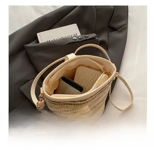 Internal capacity view of straw woven bucket bag showing ample space for essentials
