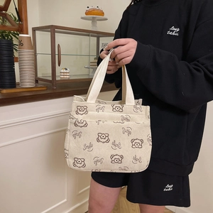Beige corduroy draagtas met bruine berenprint en praktische dubbele zakken