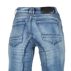 Detail of blue washed motorcycle jeans showing back waist leather patch and pockets