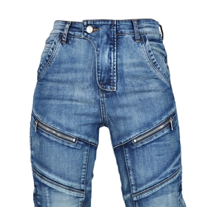 Detail of blue motorcycle denim with metal zipper pockets and heavy-duty stitching