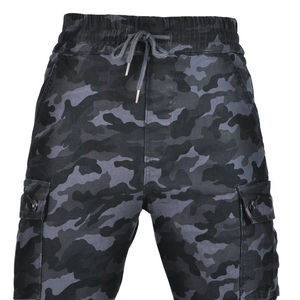 Close-up of camouflage motorcycle riding pants with elastic waist and large cargo pockets