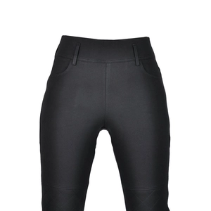 Macro view of women motorcycle pants with high waist, belt loops and quilted details