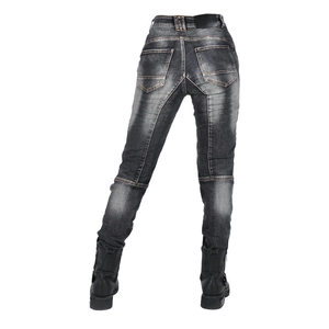Detail view of the back waist accordion stretch panels on washed grey moto jeans