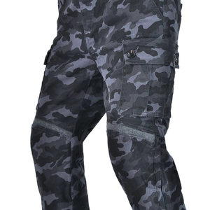 Detail showing tactical cargo side pocket and reinforced knee structure on camo riding pants
