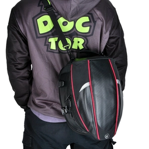 Waterproof motorcycle tail bag with carbon fiber texture and red accents shown as backpack