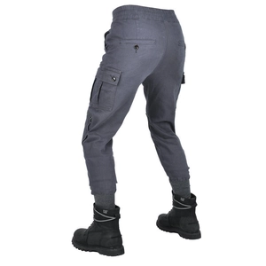 Rear view of men's dark gray motorcycle cargo pants with large flap pockets and ribbed cuffs
