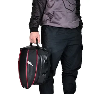 Waterproof motorcycle tail bag with carbon fiber shell and red accents for helmet storage