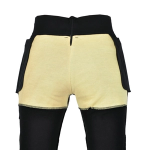 Close-up of functional motorcycle pants showing protective lining and rear metal zipper