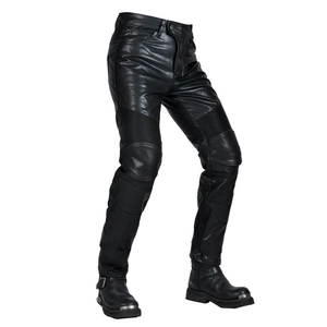 Detail view of leather motorcycle pants with knee stretch panels and tactical boots