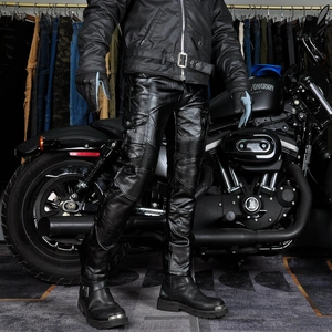 Detail of black leather motorcycle cargo pants with articulated knees and side pockets