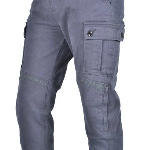 Detail of cargo pockets and reinforced knee panels on durable motorcycle riding pants