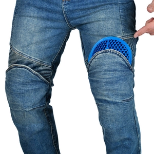 Close-up of motorcycle jeans with accordion stretch panels and blue knee armor pads
