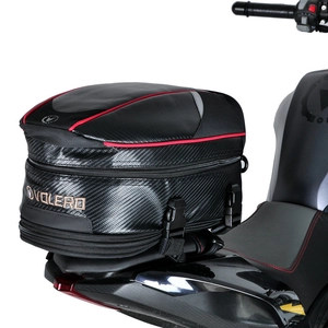 Waterproof motorcycle tail bag detail with carbon fiber texture and red accents