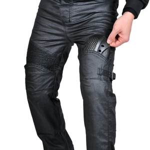 Detail of motorcycle jeans showing the installation of honeycomb knee protective pads
