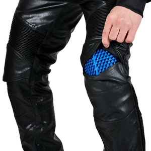 Detail view of motorcycle protective leather pants with blue honeycomb knee armor inserts