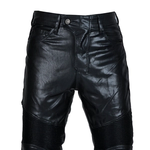 Detail of black motorcycle leather pants featuring protective knee accordion stretch panels